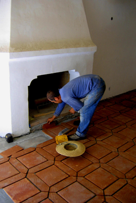 Installing spanish clay tile floor next to spanish fireplace